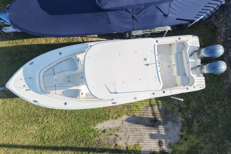 Slide: The Image of Aerial view of a 2021 Sea Hunt Ultra 305 SE boat on grass. - 3
