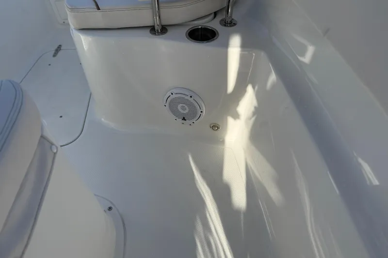 Slide: The Image of 2021 Sea Hunt Ultra 305 SE boat interior with speaker and seating area. - 34