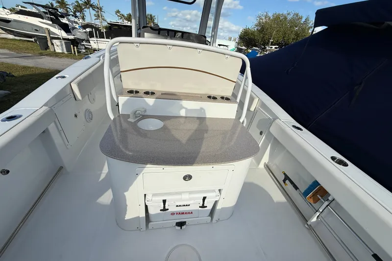Slide: The Image of 2021 Sea Hunt Ultra 305 SE boat interior with seating and storage. - 8