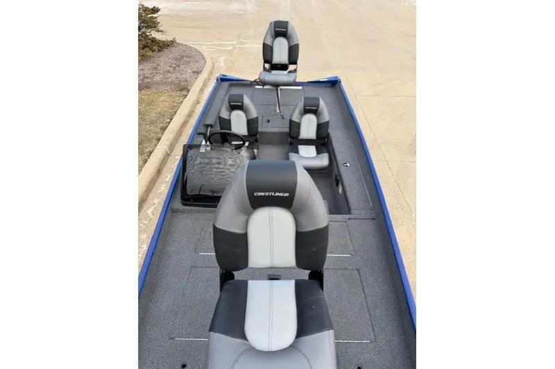 Slide: The Image of 2021 Crestliner 1700 Storm boat interior with gray and black seating. - 3