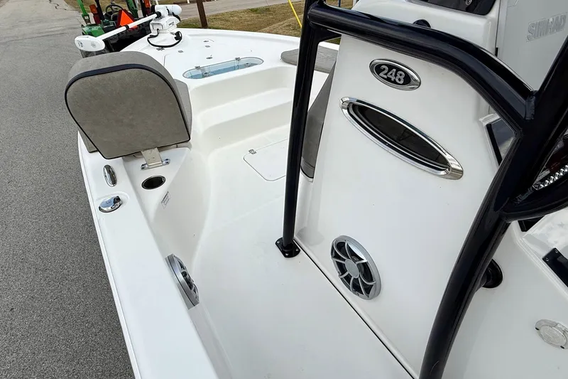 Slide: The Image of 2021 Sea Pro 248 Bay boat interior with seating and speaker detail. - 13
