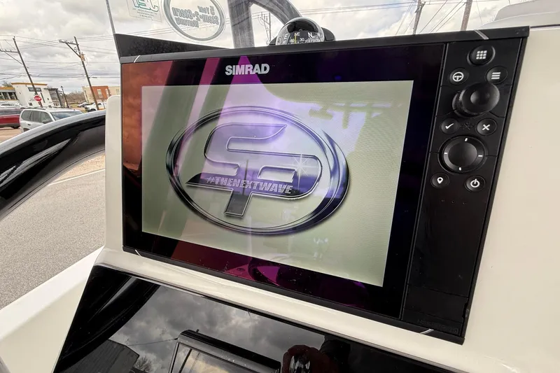 Slide: The Image of Simrad display on 2021 Sea Pro 248 Bay boat, showing logo and controls. - 18