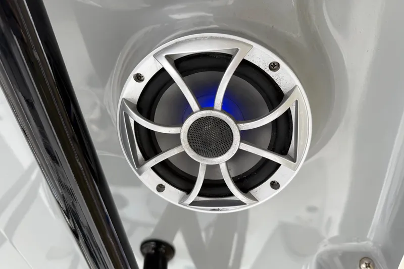 Slide: The Image of Speaker on 2021 Sea Pro 248 Bay boat, featuring sleek design and blue lighting. - 21