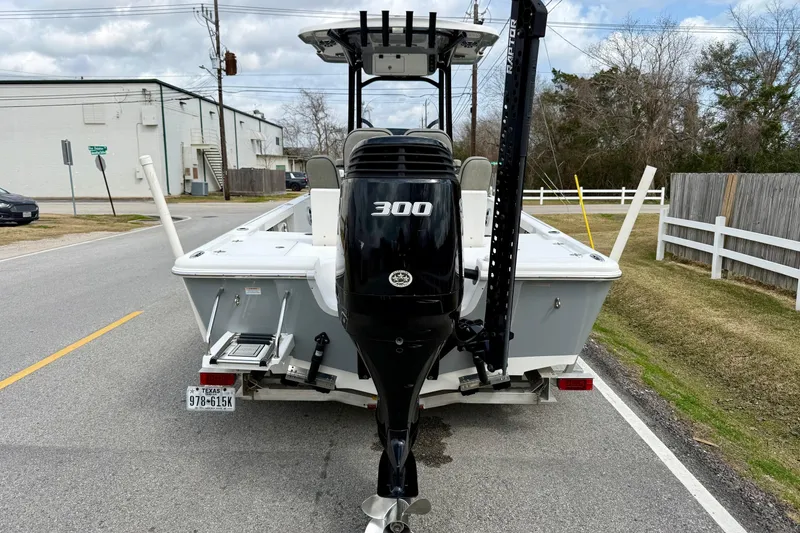 Slide: The Image of 2021 Sea Pro 248 Bay boat with 300 HP engine on a street. - 3