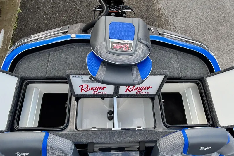 Slide: The Image of 2026 Ranger Z520R boat interior with storage compartments and branded seating. - 14