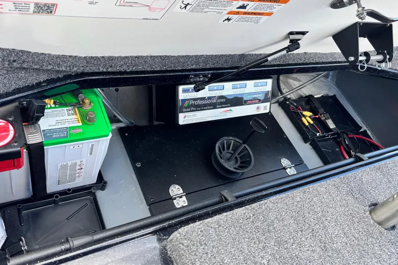Slide: The Image of 2026 Ranger Z520R boat battery compartment with professional series charger and wiring. - 16