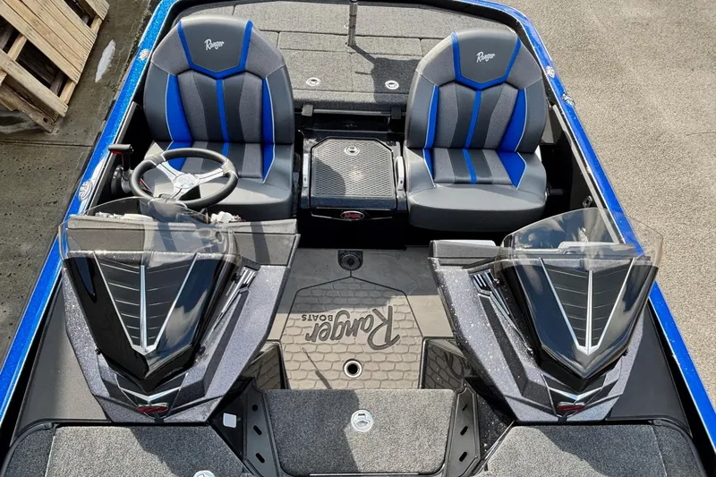Slide: The Image of 2026 Ranger Z520R boat interior with dual seats and steering wheel. - 9
