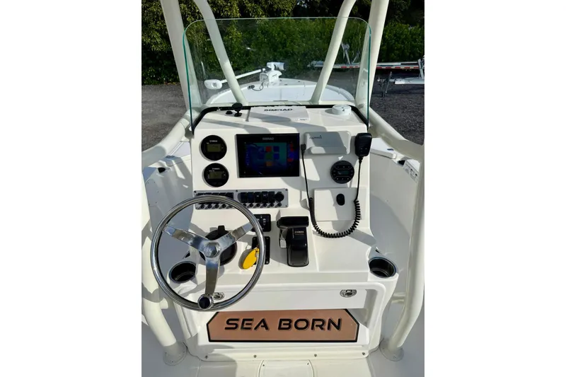Slide: The Image of 2017 Seaborn FX24 Bay boat console with steering wheel and navigation controls. - 18