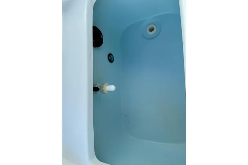 Slide: The Image of Interior view of a 2017 Seaborn FX24 Bay boat's livewell. - 27