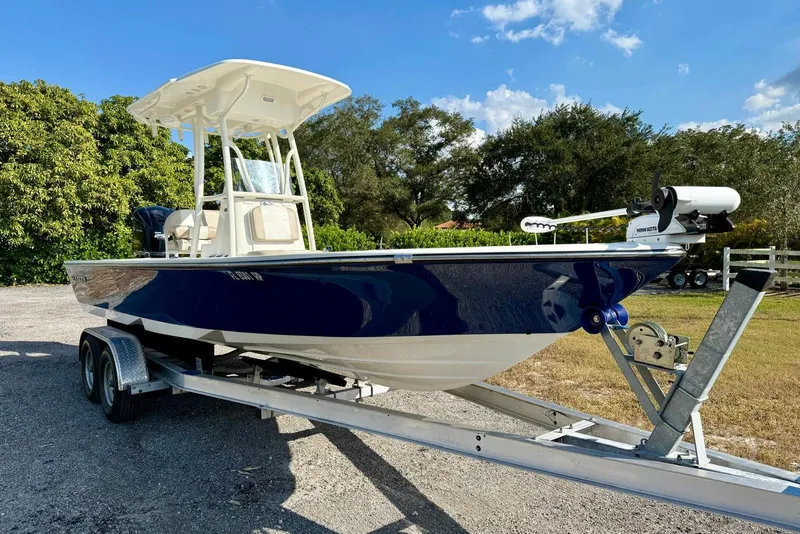 Slide: The Image of 2017 Seaborn FX24 Bay boat on trailer, parked outdoors under clear sky. - 6