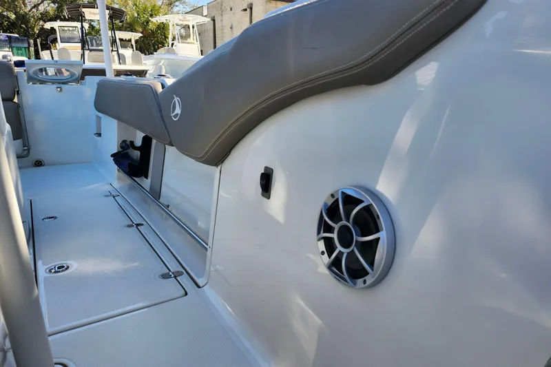 Slide: The Image of 2022 Finseeker 230 CC boat interior with seating and speaker detail. - 20