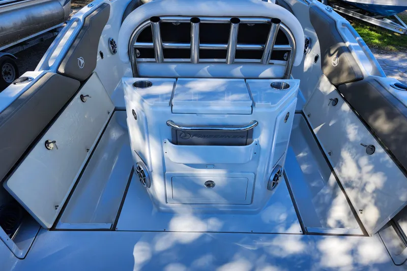 Slide: The Image of 2022 Finseeker 230 CC boat interior with seating and storage compartments. - 25