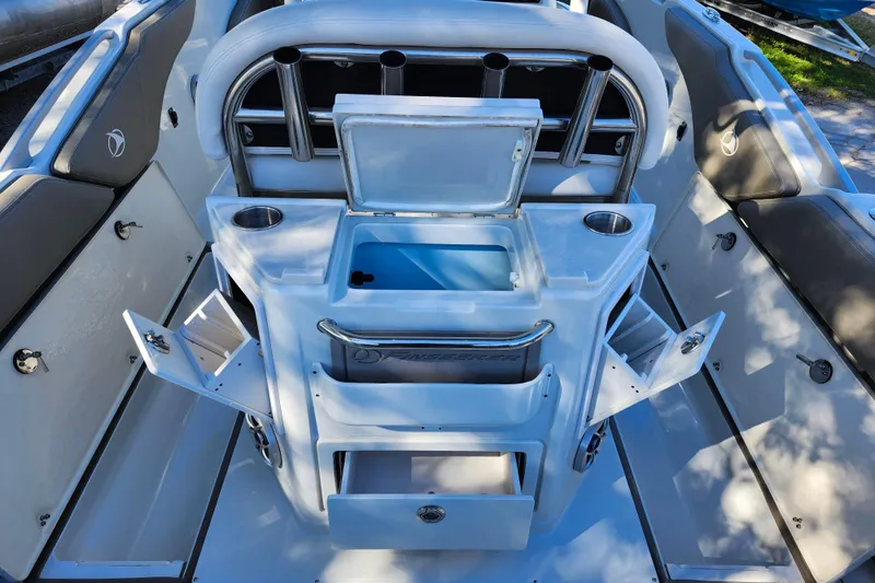 Slide: The Image of 2022 Finseeker 230 CC boat interior with open storage compartments and seating. - 30