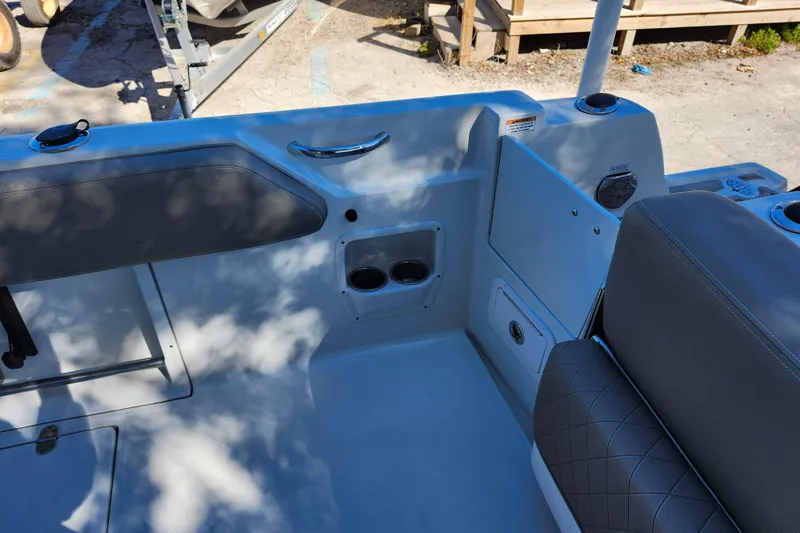 Slide: The Image of Interior view of 2022 Finseeker 230 CC boat, featuring seating and storage compartments. - 38
