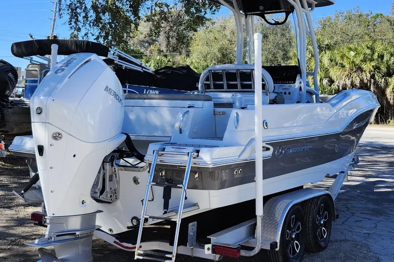 Slide: The Image of 2022 Finseeker 230 CC boat with Mercury outboard engine, parked on a trailer. - 4