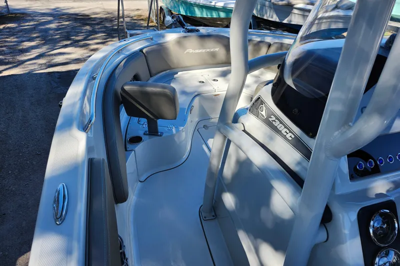 Slide: The Image of 2022 Finseeker 230 CC boat interior with seating and console details. - 42