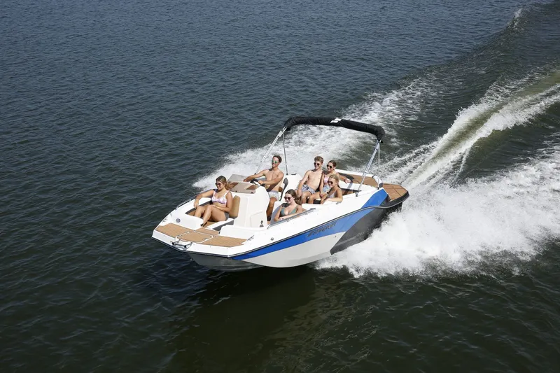 Slide: The Image of Starcraft 211SVXIO 2026 boat cruising on water with passengers. - 2