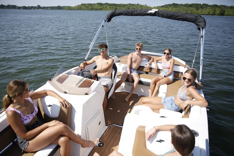 Slide: The Image of Group of young people on a Starcraft 211SVXIO boat, 2026 model. - 3