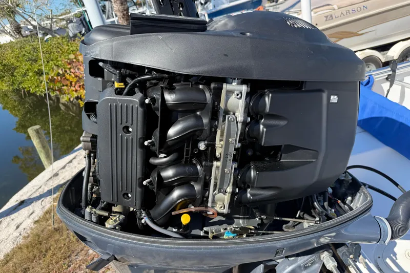 Slide: The Image of 2002 Cobia 191 Bay boat engine, detailed view of motor components. - 11