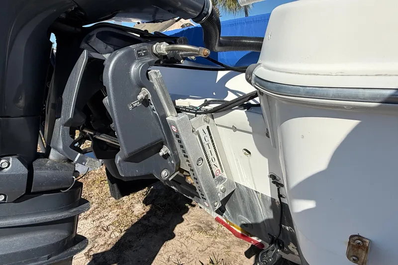 Slide: The Image of 2002 Cobia 191 Bay boat engine and transom detail in sunlight. - 14