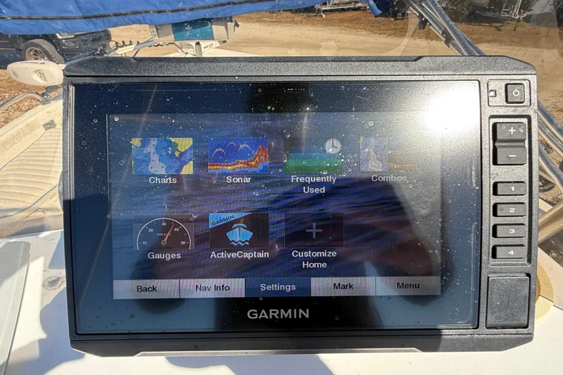 Slide: The Image of Garmin marine GPS display on a 2002 Cobia 191 Bay boat, showing navigation options. - 29