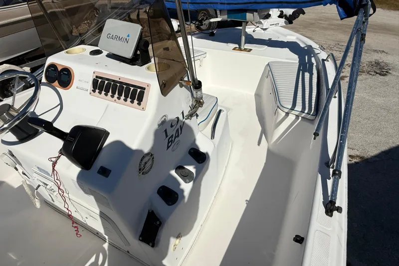 Slide: The Image of 2002 Cobia 191 Bay boat interior with Garmin navigation system and control panel. - 33
