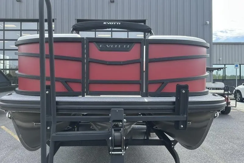 Slide: The Image of 2026 Evotti 521CS pontoon boat with red panels, displayed outdoors. - 13
