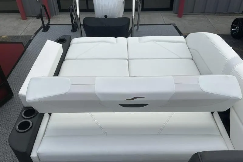 Slide: The Image of 2026 Evotti 521CS boat interior with white leather seating and cup holders. - 15