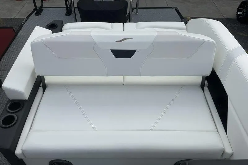 Slide: The Image of 2026 Evotti 521CS boat interior with white cushioned seating and cup holders. - 17