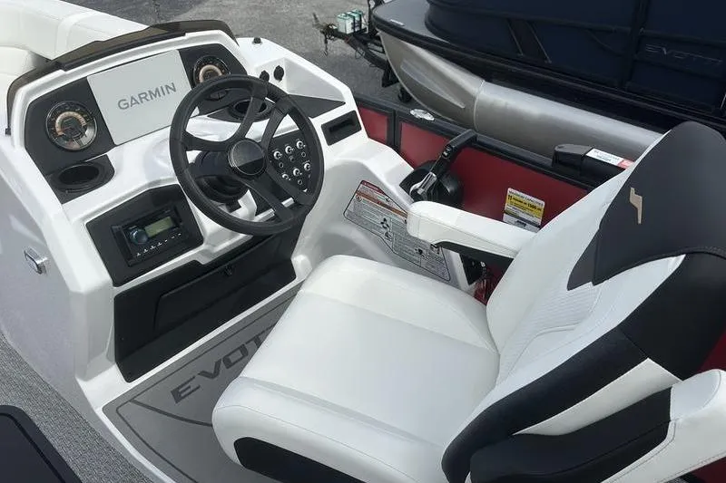 Slide: The Image of Cockpit of 2026 Evotti 521CS boat with Garmin navigation system and white seating. - 20