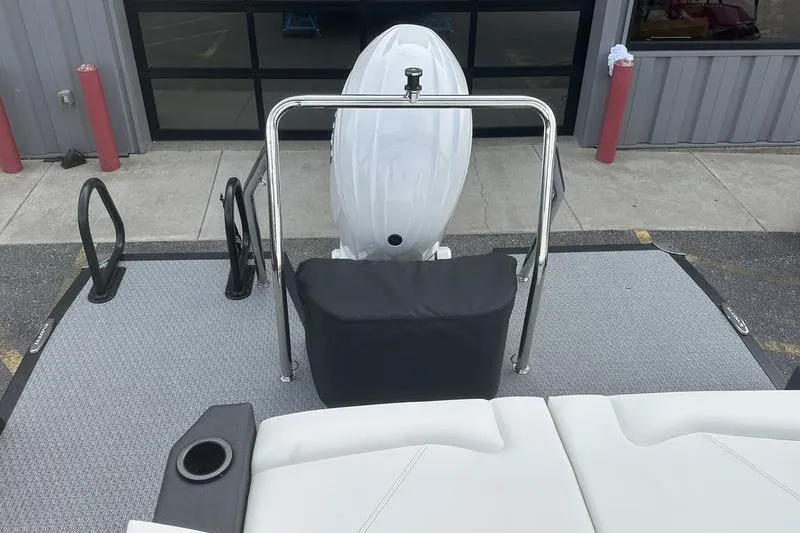 Slide: The Image of 2026 Evotti 521CS boat deck with outboard motor and seating area. - 24