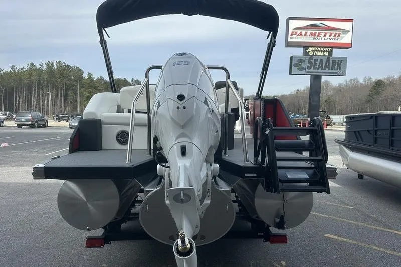 Slide: The Image of Rear view of 2026 Evotti 521CS boat with powerful outboard motor at dealership. - 6
