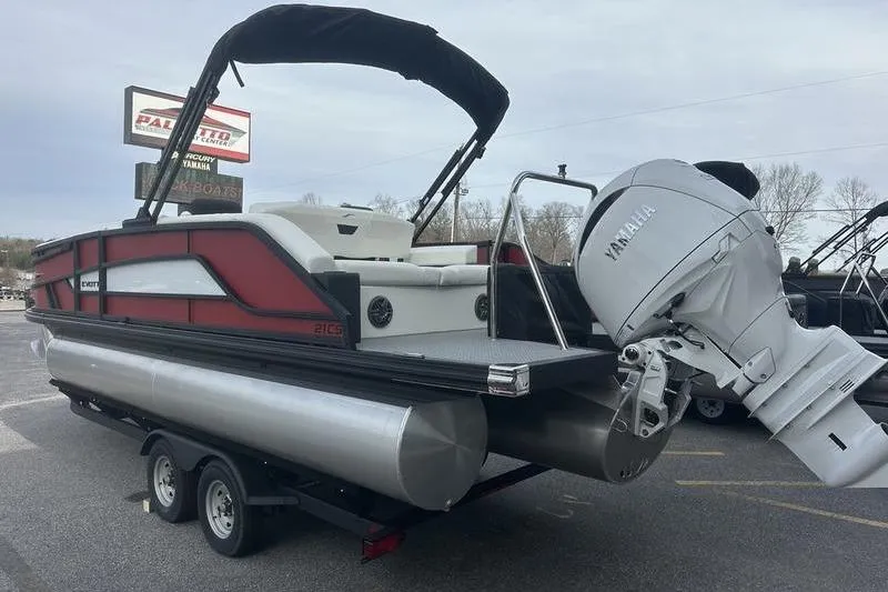 Slide: The Image of 2026 Evotti 521CS pontoon boat with Yamaha outboard motor on trailer. - 7