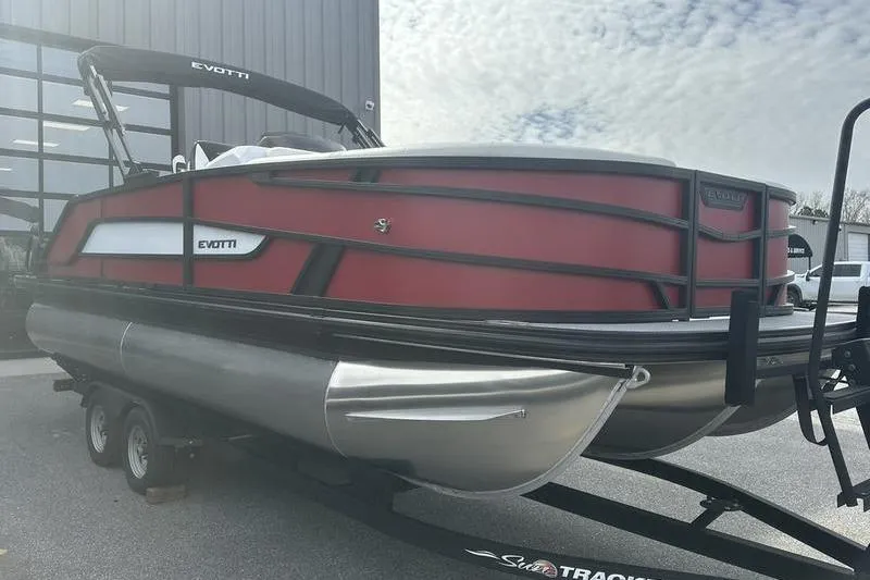 Slide: The Image of 2026 Evotti 521CS pontoon boat on trailer, featuring sleek red and black design. - 9