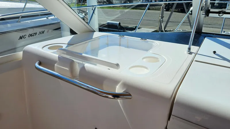 Slide: The Image of Tiara Yachts 2900 Coronet 2006, deck view with handle and cup holders. - 12