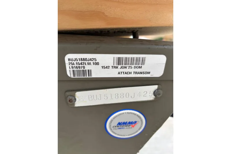 Slide: The Image of 2025 Tracker Grizzly 1542 Utility boat identification labels and NMMA certification sticker. - 11