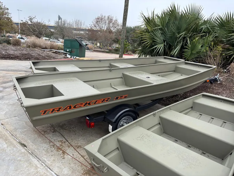 Slide: The Image of 2025 Tracker Grizzly 1542 Utility boat on trailer, parked outdoors. - 31
