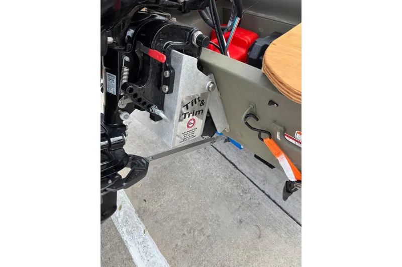 Slide: The Image of 2025 Tracker Grizzly 1542 Utility boat motor with tilt and trim mechanism. - 9