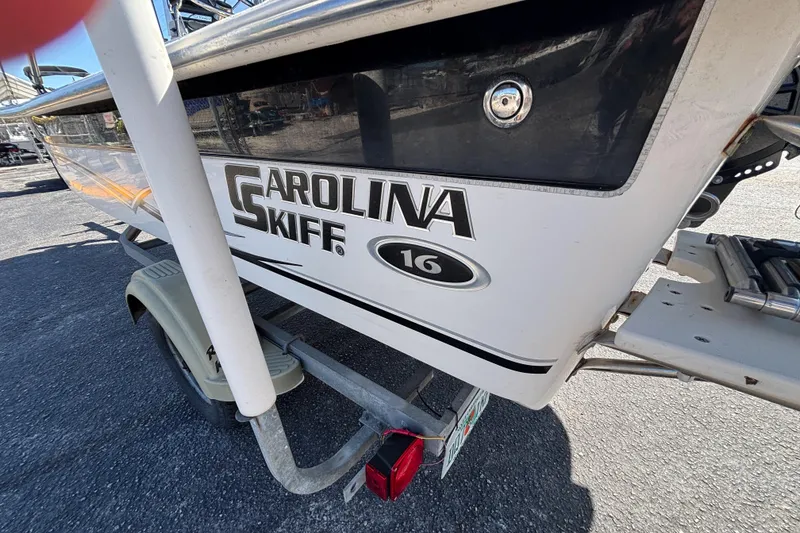 Slide: The Image of 2016 Carolina Skiff 16 JVX CC boat on trailer, close-up view. - 13