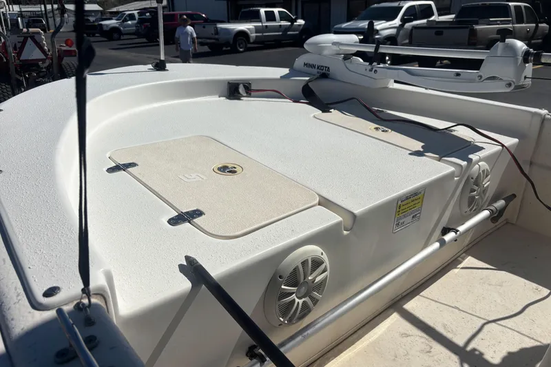 Slide: The Image of 2016 Carolina Skiff 16 JVX CC boat deck with storage compartments and speakers. - 15