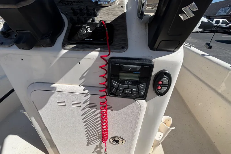 Slide: The Image of 2016 Carolina Skiff 16 JVX CC console with Suzuki controls and Boss audio system. - 21