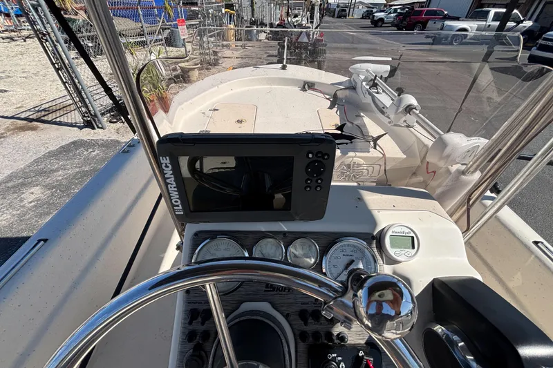 Slide: The Image of 2016 Carolina Skiff 16 JVX CC dashboard with Lowrance navigation system and gauges. - 26