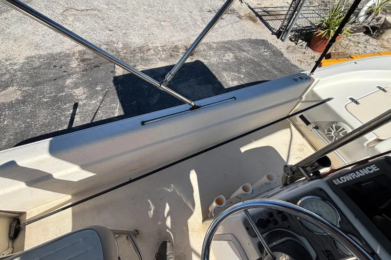 Slide: The Image of 2016 Carolina Skiff 16 JVX CC boat interior with steering console and seating. - 27