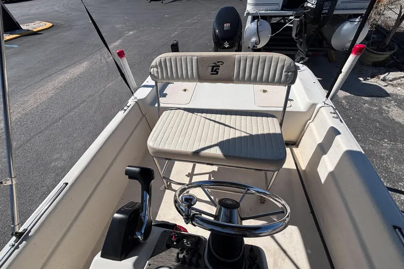 Slide: The Image of 2016 Carolina Skiff 16 JVX CC boat interior with steering wheel and seating. - 31