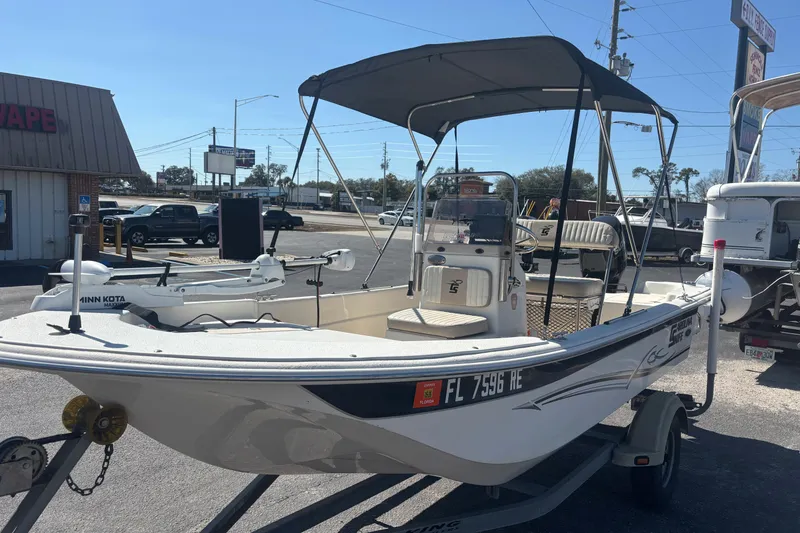 Slide: The Image of 2016 Carolina Skiff 16 JVX CC boat on trailer, parked outdoors. - 4