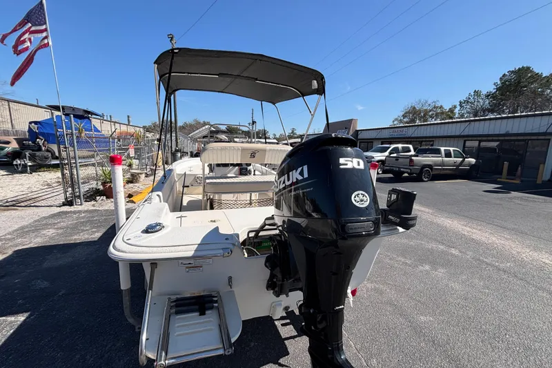 Slide: The Image of 2016 Carolina Skiff 16 JVX CC boat with Suzuki 50 outboard motor in parking lot. - 7