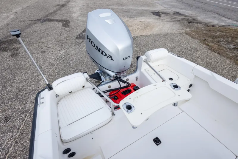 Slide: The Image of 1999 Boston Whaler Outrage 17 boat with Honda 150 outboard motor, white seating. - 16