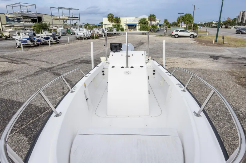 Slide: The Image of 1999 Boston Whaler Outrage 17 boat on display at a marina. - 33
