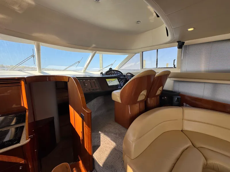 Slide: The Image of Luxurious 2005 Viking Princess 50 Flybridge yacht interior with leather seating and modern helm. - 11