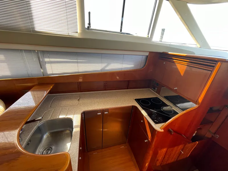Slide: The Image of Luxurious kitchen area in 2005 Viking Princess 50 Flybridge yacht with modern amenities. - 15